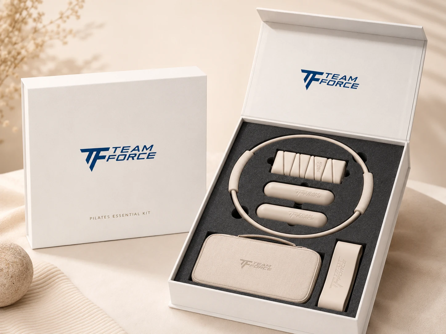 Premium Teamforce Pilates essential kit displayed in custom branded packaging with fitted protective inserts